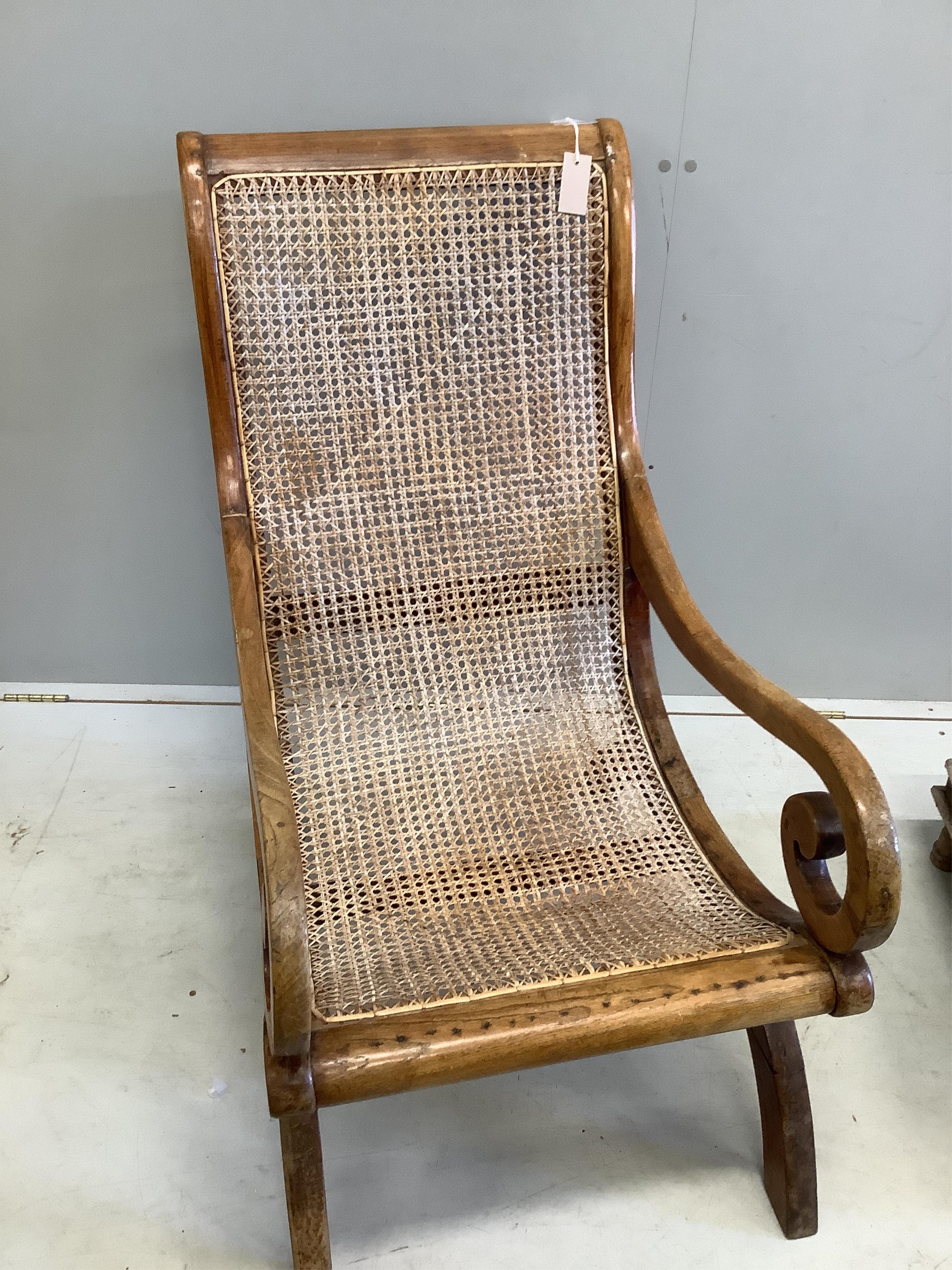 A South East Asian caned hardwood armchair, width 55cm, depth 80cm, height 98cm together with a square low table